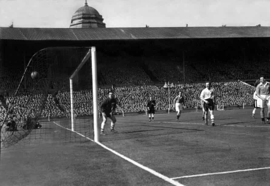Goalkeeper Stan Hanson is rooted to the spot as Mortensen’s free-kick beats him.