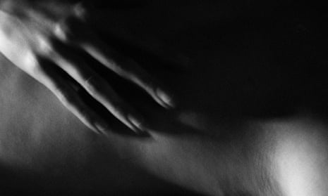 Woman’s hand stroking nude body, close-up, black and white.AWNMAE Woman’s hand stroking nude body, close-up, black and white.