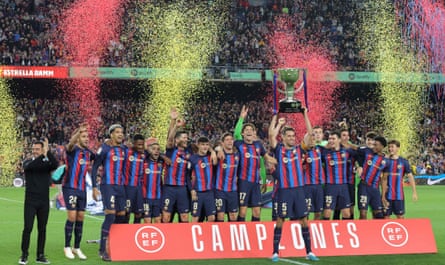 Sergio Busquets lifts his ninth and final La Liga trophy with Barcelona last month.
