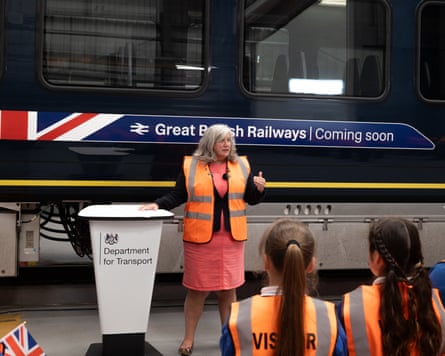 Heidi Alexander talks to young visitors as she unveils a train carriage with Great British Railways branding
