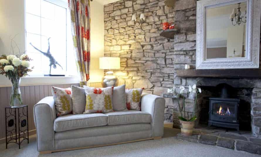 Cosy sofa and woodburner in Ty Croeso, Wales.