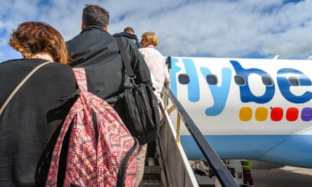 Passengers boarding an Embraer E175 jet operated by Flybe
