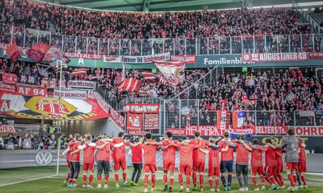 Bayern Munich’s players celebrate in front of their fans at the Volkswagen Arena