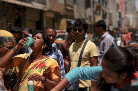 A woman drinks curd to cool herself down during a hot day in Bengaluru, Karnataka, India, April 24, 2024.