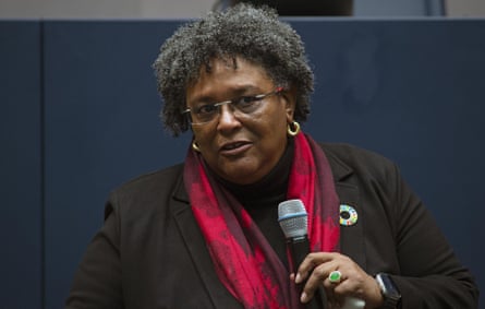 Mia Mottley holding a microphone
