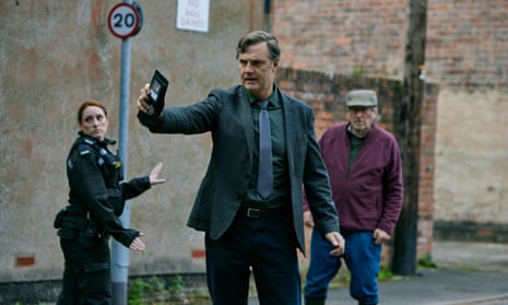 David Morrissey holds up his police badge in Sherwood.
