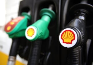 Shell logos on petrol pumps at a petrol station.