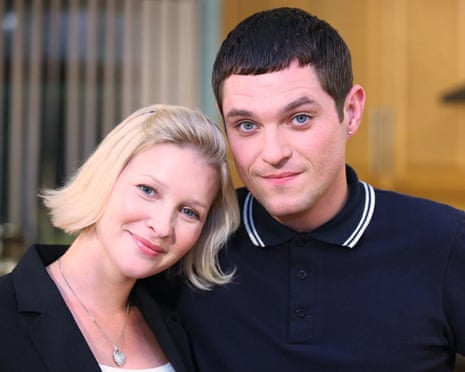 Page with her head tilted towards Horne's shoulder, him in a black polo shirt, her in a black jacket over a white T-shirt