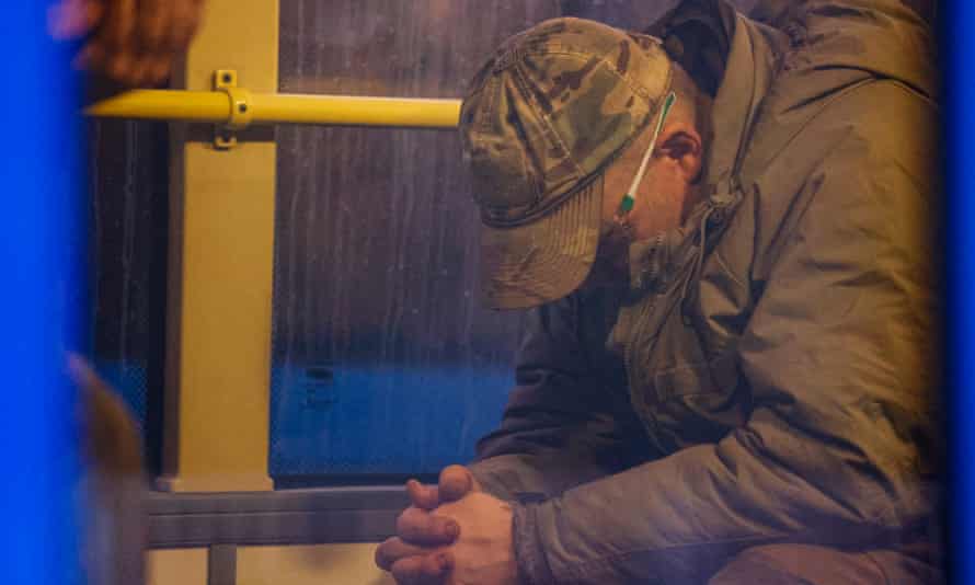 Ukrainian servicemen sitting in a bus as they are being evacuated from the besieged Azovstal steel plant in Mariupol