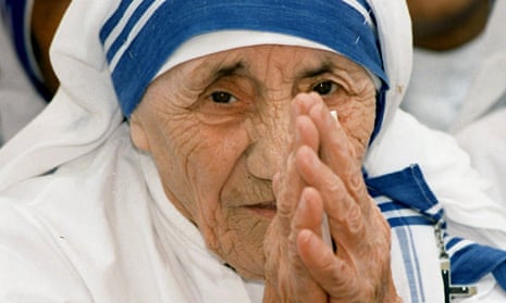 Mother Teresa greets people at the Missionaries of Charity for destitute children in Delhi in 1997.