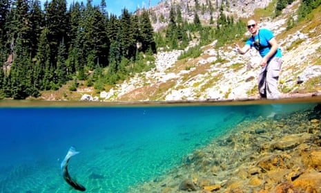 Fishing in a clear lake for trout in Washington State, US