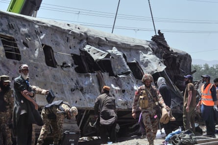 damaged train in Quetta with emergency workers