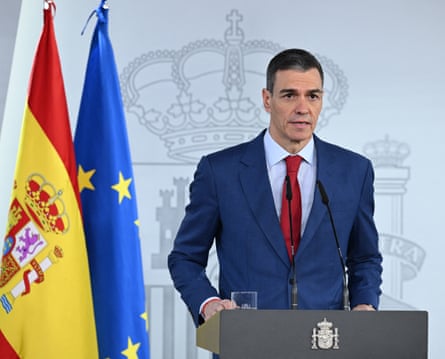 Spain’s prime minister, Pedro Saánchez, speaks at a podium next to Europe and Spain flags