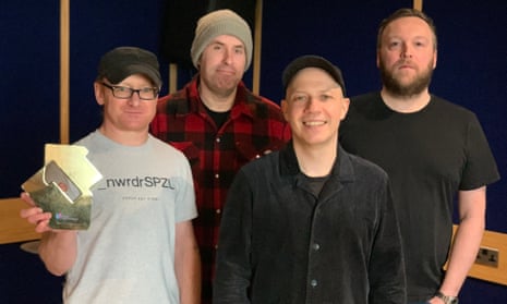 Mogwai with their award for their No 1 album As the Love Continues, with Stuart Braithwaite second right.