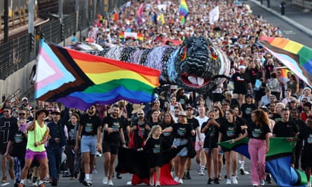 People take part in Pride March over the Sydney Harbour Bridge on 5 March this year.