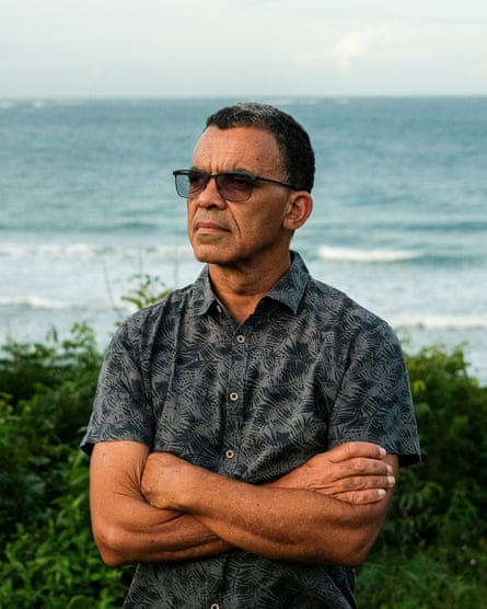 David Obura stands in front of the ocean