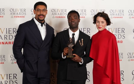 Paapa Essiedu, centre, with his best supporting actor award, and presenters Aaron Pierre and Olivia Williams.