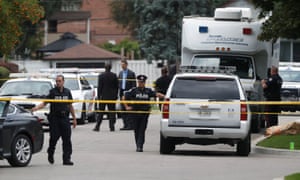 Police attend the scene in the Scarborough suburb of Toronto following the crossbow deaths of three people.