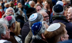 Men wear kippahs outside a Jewish community centre in Berlin