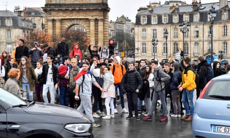 High school students block a road during a demonstration against education reforms in Bordeaux.