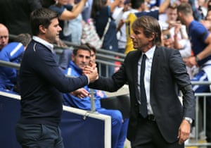 Pochettino and Conte greet.