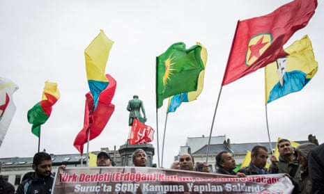 Protesters in Brussels denounce attacks on Kurds in Turkey and Iraq.