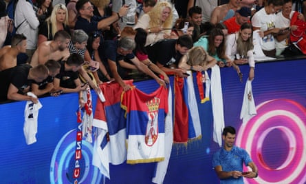 Novak Djokovic takes a selfie with fans after winning his first-round match