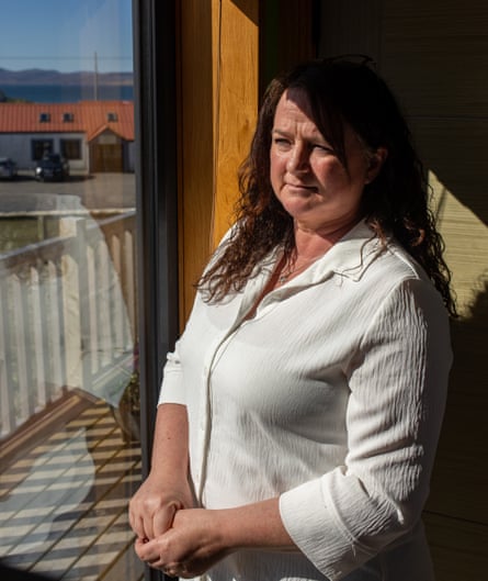 Sandra MacInness standing at a window