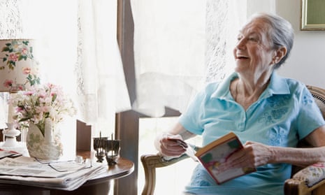 Mature woman smiling with book