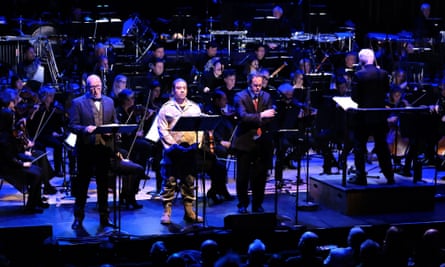 John Adams conducts the BBC Symphony Orchestra in his 2005 opera Doctor Atomic at the Barbican, with (l-r) Brindley Sherratt, Aubrey Allicock and Gerald Finley.