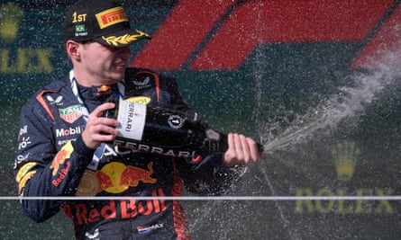 Max Verstappen celebrates by spraying champagne after winning the Brazilian grand prix.