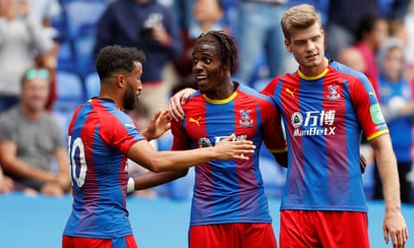 Wilfried Zaha, centre, is congratulated by Andros Townsend and Alexander Sørlorth after scoring for Crystal Palace against Reading last month