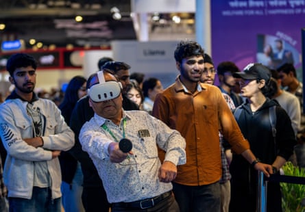 A visitor takes part in a virtual reality demonstration at the summit.