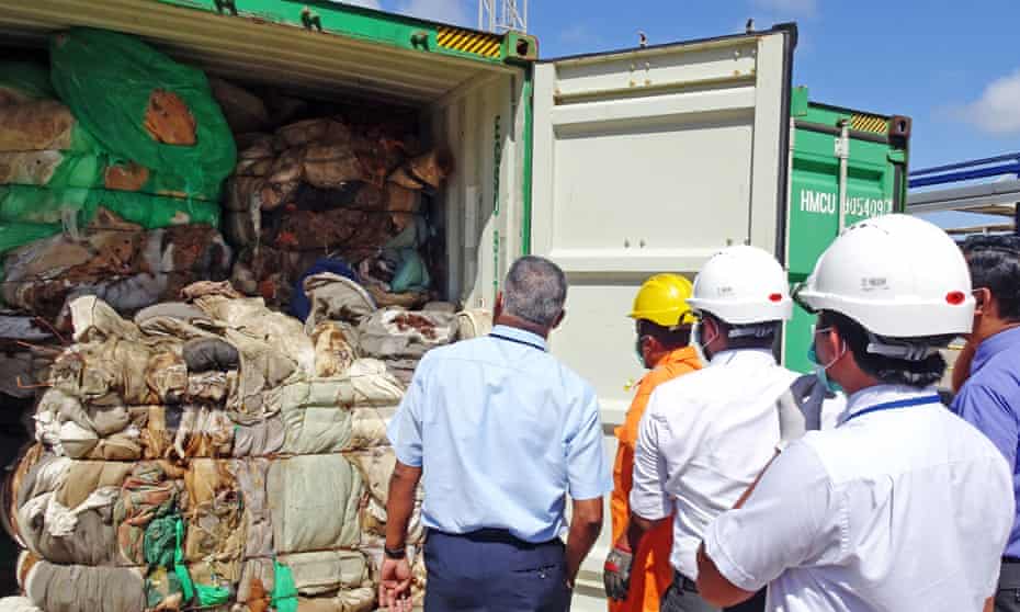 Sri Lankan customs officials inspect the containers at a port in Colombo.
