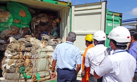 Sri Lankan customs customs officials inspect a container full of mattresses