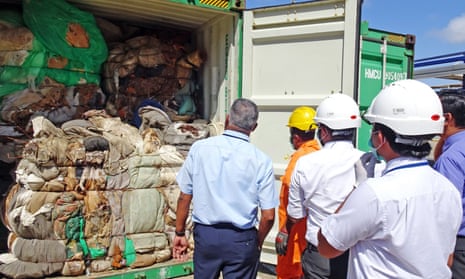 Customs officials inspect container