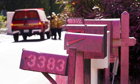 Pink mailboxes covered with retardant