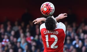 Arsenal's French striker Olivier Giroud tries to head the ball during their game against Norwich.