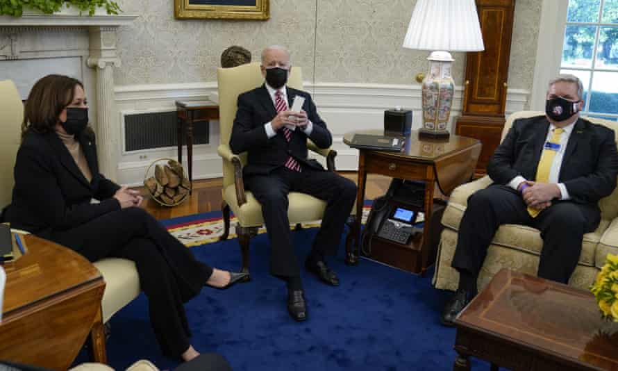 Kamala Harris and Joe Biden meet with labor leaders in the Oval Office of the White House, including Eric Dean, general president of the Ironworkers International Union, right, in February.