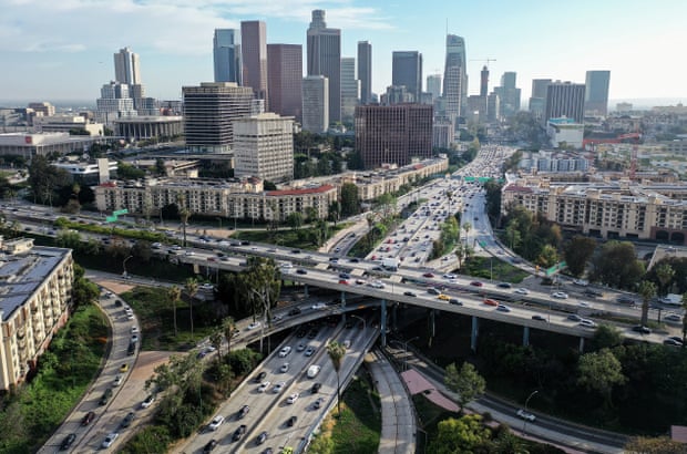 An aerial view of downtown Los Angeles and its freeways packed with cars during the afternoon commute.