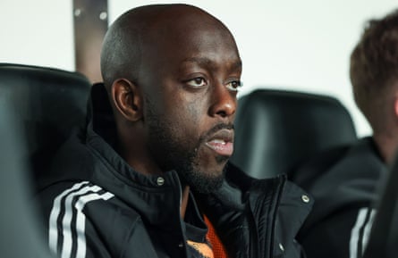 Yoane Wissa cuts a frustrated figure as he sits on the Newcastle bench