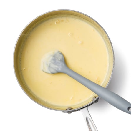 hot cream with egg yolks whisked in