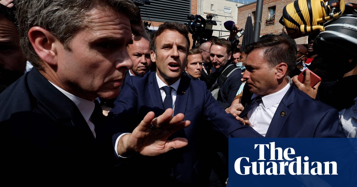 Tomatoes hurled at French president Emmanuel Macron – video