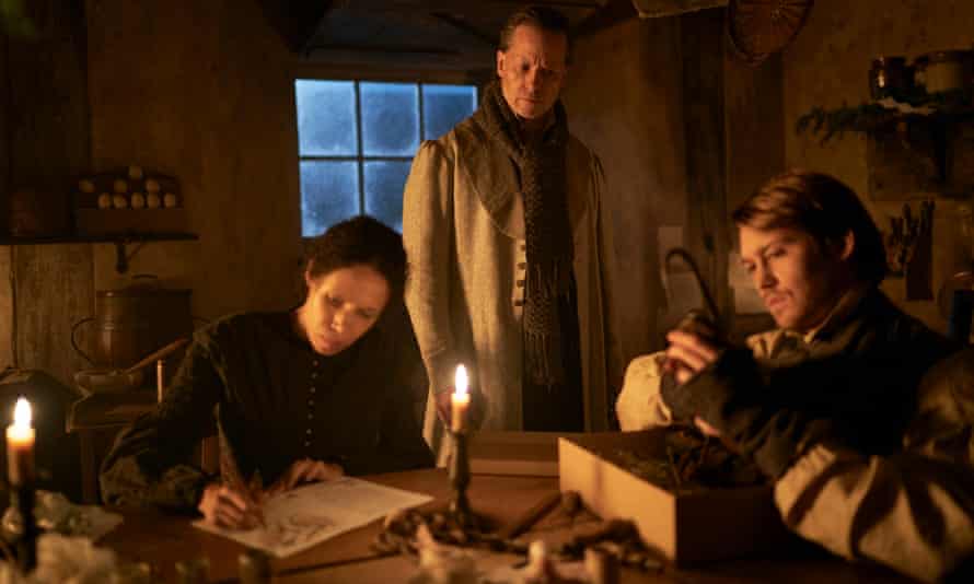 A winter’s tale … Vinette Robinson (left) as Mary Cratchit in A Christmas Carol, with Guy Pearce as Scrooge and Joe Alwyn as her husband Bob.