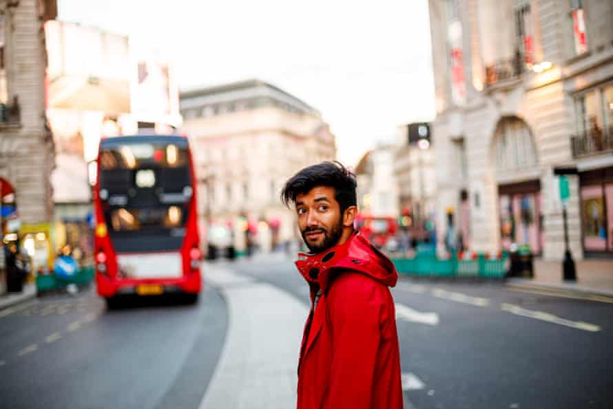 Lashan who moved to Montreal, then London, stands on Regent Street