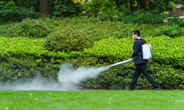 A worker sprays disinfectant inside a gated community as Hangzhou launches a new round of citywide antigen and nucleic acid testing on 28 April 2022 in Hangzhou, Zhejiang Province of China.
