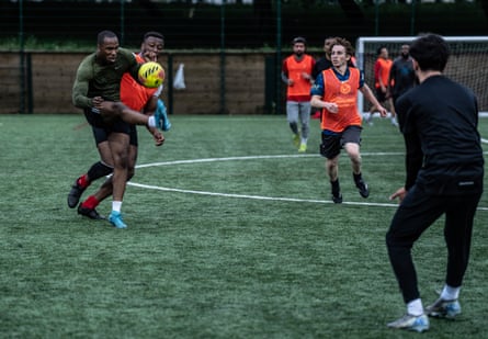 Group of men playing football at Barnard Park