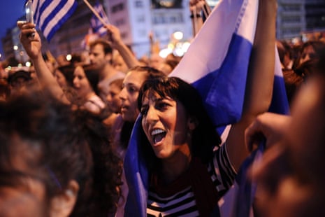 epa04824361 A woman shouts slogans holding a Greek flag during a demonstration of the NO supporters in central Syntagma Square, in front of the Greek parliament building, in Athens, Greece, 29 June 2015. Greek voters will decide in a referendum on next Sunday whether their government should accept an economic reform package put forth by Greece’s creditor. Greece has imposed till the referendum capital controls and the banks will be closed till then. EPA/FOTIS PLEGAS G.