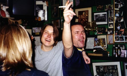 Damien Hirst and Sarah Lucas behind the bar at the club.