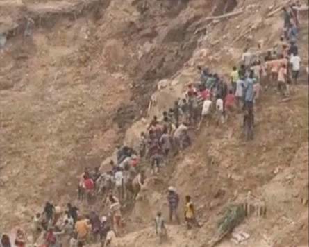 Screenshot of people on a steep hill